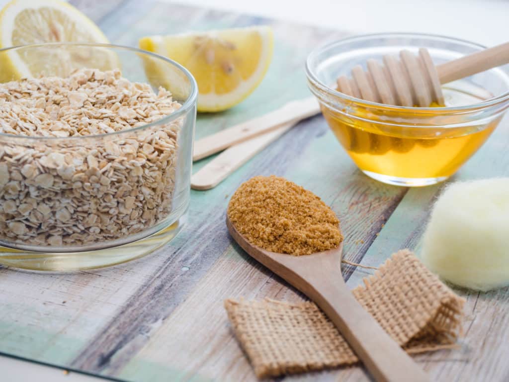 Use a natural lemon honey and sugar body scrub to remove tan