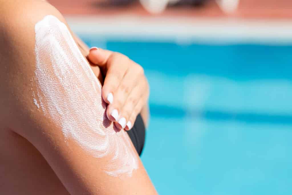 Combine umbrella and sunscreen for shade and sun protection